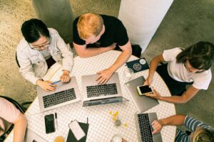 Aerial view of people working on laptops