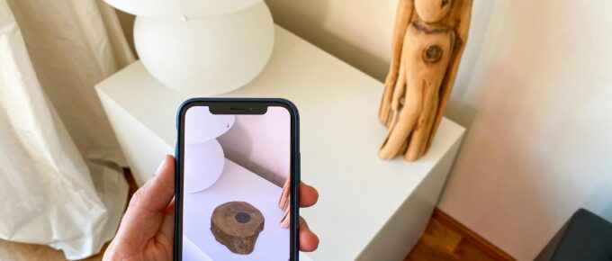 A person holding a phone for AR product visualization