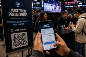 FanPlay fan engagement activation at a hockey arena, showing a smartphone with a prediction game interface — "Make Your Predictions" — alongside a branded QR code sign encouraging fans to predict, earn points, and win prizes during a live game.